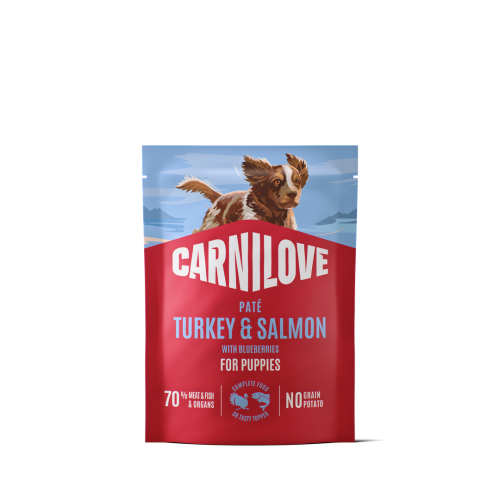 Carnilove Dog Pouch Paté z indykiem i łososiem 300 g – przód czerwonej saszetki karmy dla szczeniąt z ilustracją psa