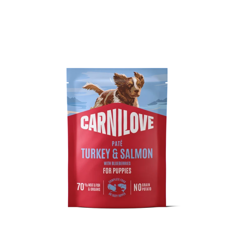 Carnilove Dog Pouch Paté z indykiem i łososiem 300 g – przód czerwonej saszetki karmy dla szczeniąt z ilustracją psa